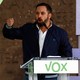 Santiago Abascal stands at a podium and passionately delivers a speech.