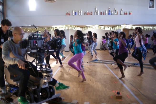 Camerapeople filming girls dancing