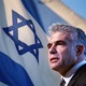 Israeli foreign minister Yair Lapid against an Israeli flag background