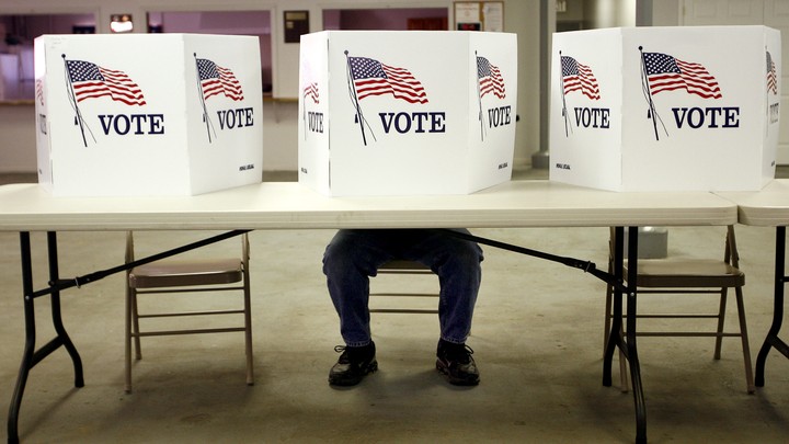 A man at a voting station