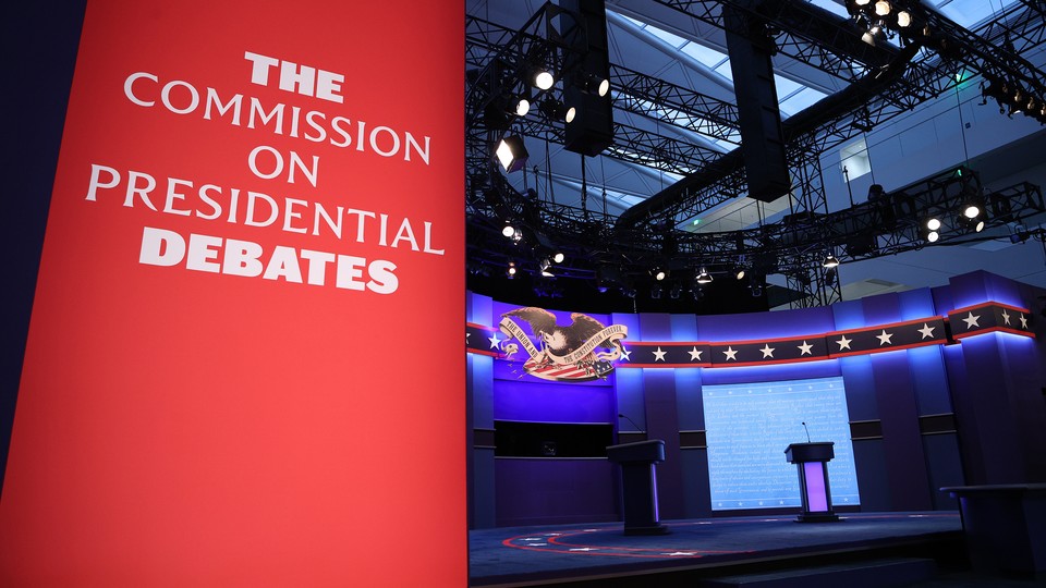 Sign to the right of a debate stage that says "The Commission on Presidential Debates"