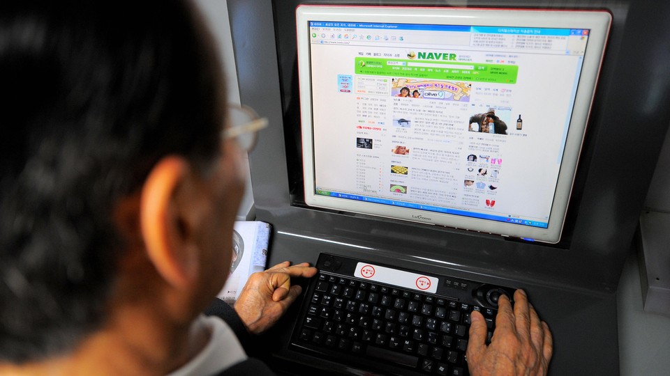 A person visits the Naver website on a desktop computer