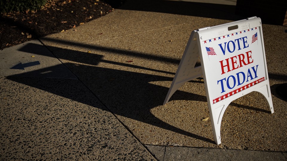 A Vote Here Today sign sits outside of an early voting location