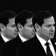 Four repeated images of Marco Rubio in front of a black background