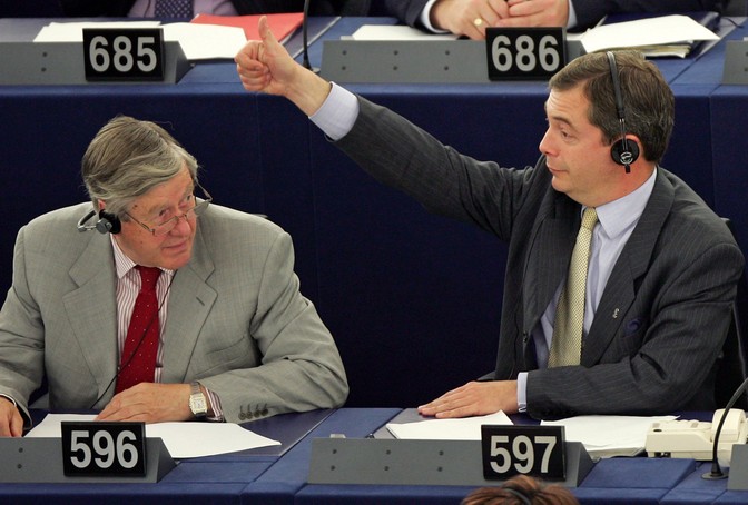 At the European Parliament, Nigel Farage gives a thumbs up to colleagues.