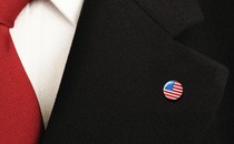 a flag pin on a suit lapel