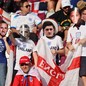 England fans wear masks of players ahead of the team's November 21 match against Iran