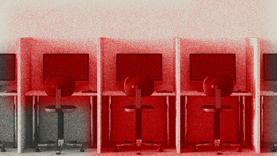 An image of office desks with a red hue