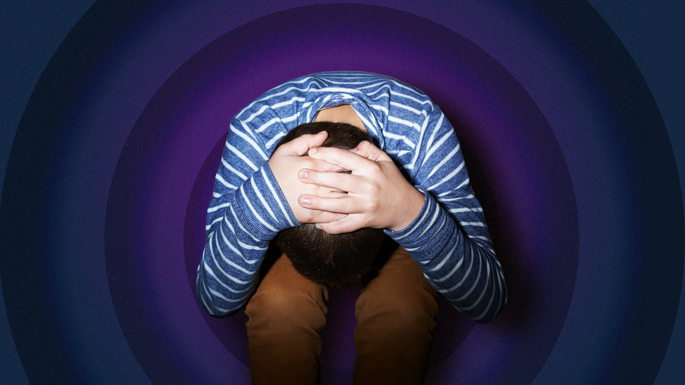 A child holding their head in the fetal position against a background of purple concentric circles