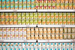 Cans of fruit salad at a grocery store