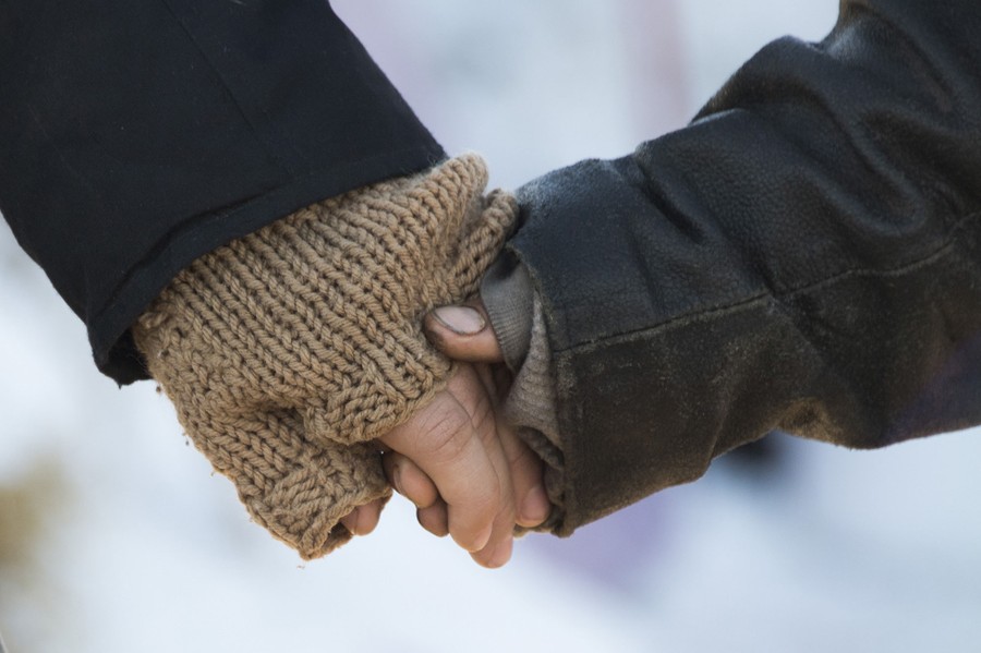 Activists hold hands during a prayer circle as they try to surround the entire Oceti Sakowin Camp on December 4, 2016.