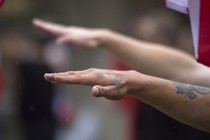 Two arms raised in Nazi salutes