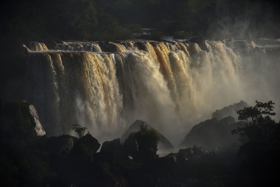 A view of a broad and very full waterfall