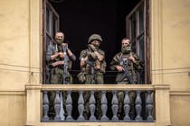 Three soldiers on a balcony