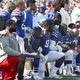 Buffalo Bills players take a knee