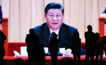A large screen showing Xi Jinping