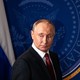 Photograph of Vladimir Putin in front of the seal of the United States