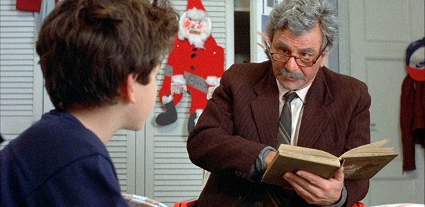 A still of an old man reading a book to a child from The Princess Bride