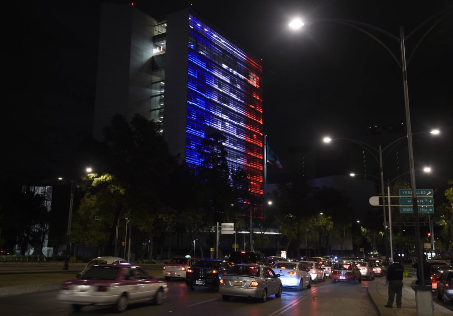 The Mexican Senate building lit in blue, white, and red