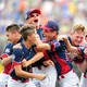 The winning team celebrates at the Little League World Series.