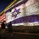 The Israeli and U.S. flags are projected against the wall of the old city of Jerusalem during the visit of President Biden.
