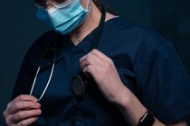 Doctor wearing scrubs.