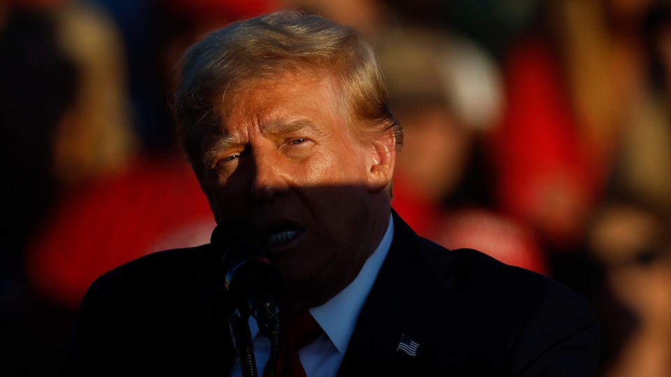 Close-up photo of Donald Trump in partial shade