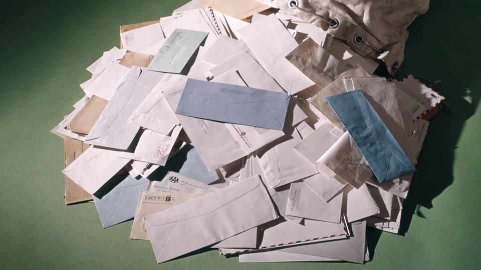 A pile of envelopes spilling onto the ground