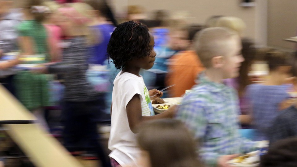 A blurry photo of students in a school cafeteria