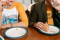 A photo of kids eating pizza