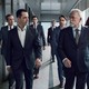 Promotional photo with the cast of Succession walking down a hallway.