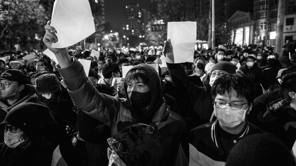 Black-and-white photo of protesters on the street in Beijing, China