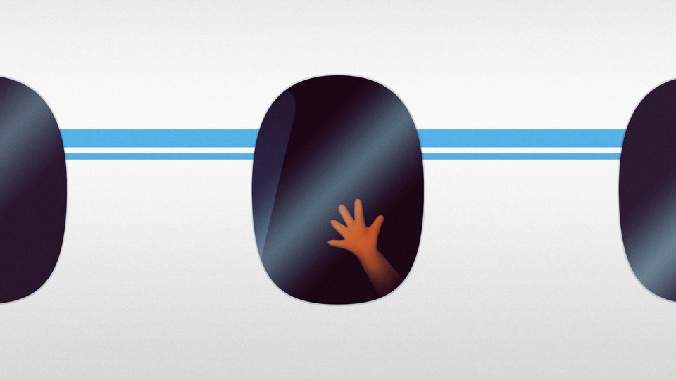 A child's hand on an airplane window