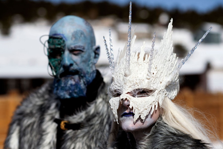 A couple are in costume during a festival.