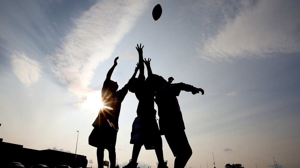 Children play football.
