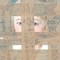 photo detail of antique painting of a face with blue eyes, obscured by a grid of packing tape stuck directly to painting