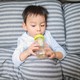 A toddler drinks from a bottle.