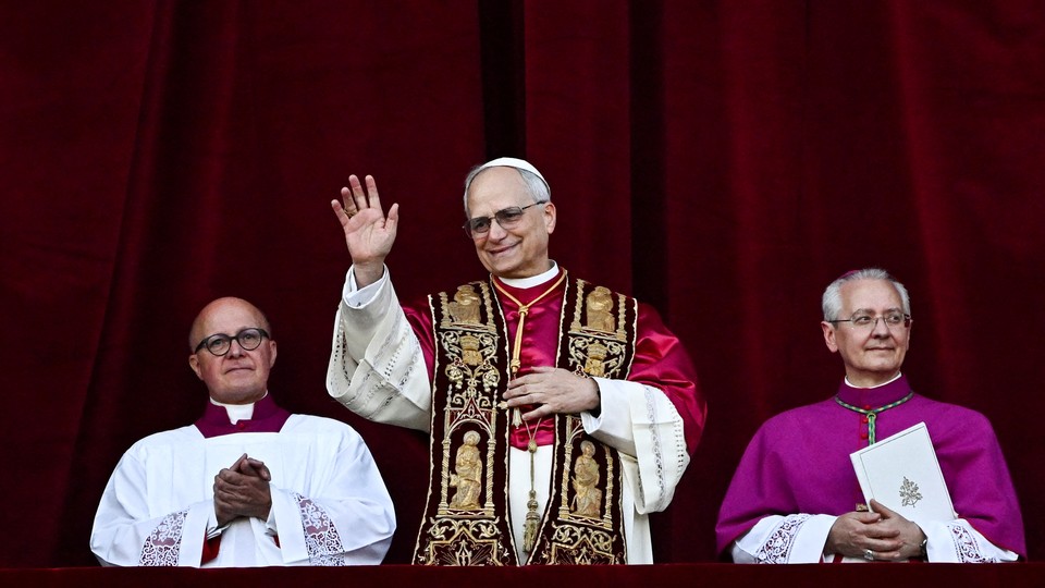 Pope Leo, flanked by two other high-ranking Catholic leaders