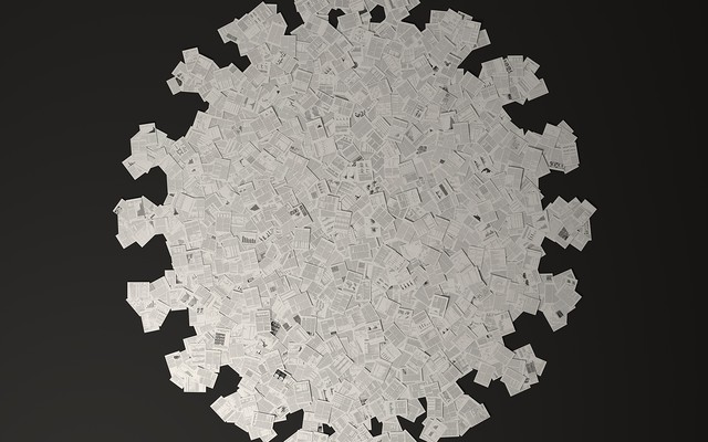 illustration of scientific papers in the shape of the coronavirus