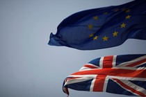 The Union Jack (bottom) and the European Union flag (top) are seen flying.