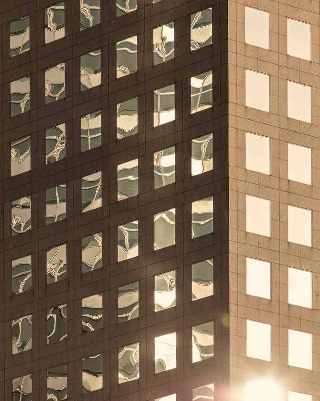 the side of a building with reflective windows