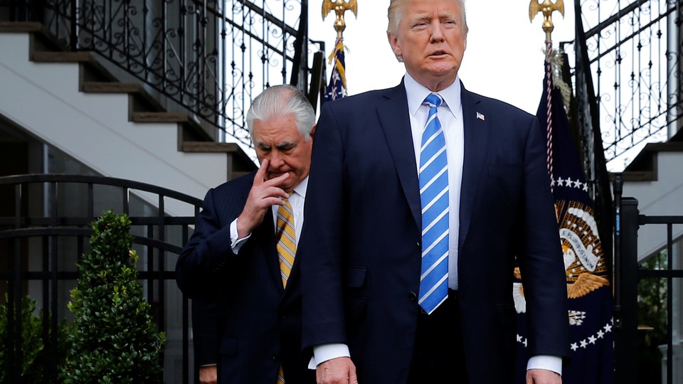 President Trump, trailed by Secretary of State Rex Tillerson,