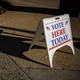 A Vote Here Today sign sits outside of an early voting location