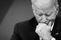 A black-and-white photo of Joe Biden looking pensive