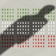 A man's shadow falls over boxes of numbers that are color-coded to look like the Iranian flag, in green, white, and red