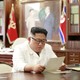 North Korean leader Kim Jong Un reads a letter from American President Donald Trump.