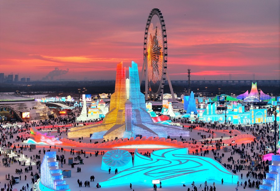 An aerial view of illuminated ice sculptures at an ice festival