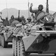 A convoy of Soviet troops waves to crowds during its withdrawal from Afghanistan on May 15, 1988.