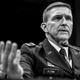 black-and-white photo of Michael Flynn in uniform testifying at a microphone