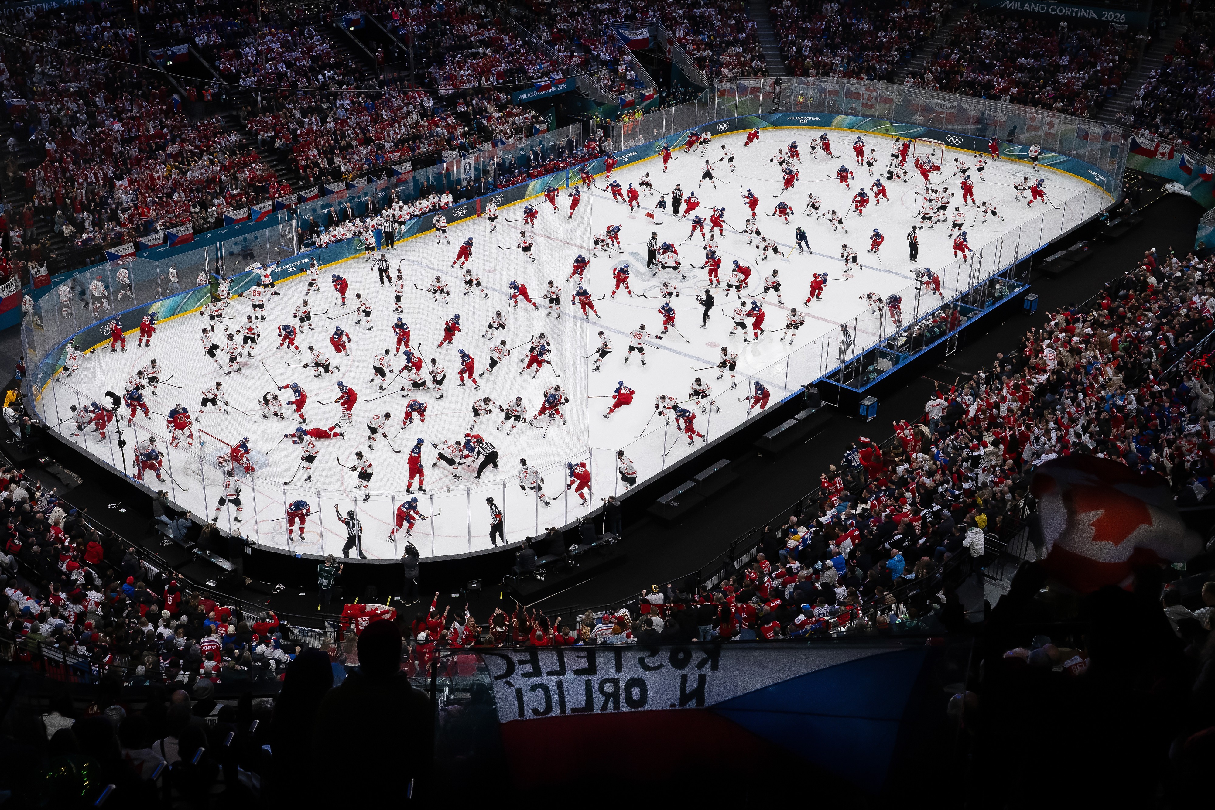 A digital composite view of an ice hockey game, making it appear as if dozens of players were on the ice simultaneously, evenly spaced-out.